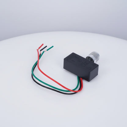 A small black electronic module with a silver threaded connector and three wires in red, green, and black, shown on a plain white background.